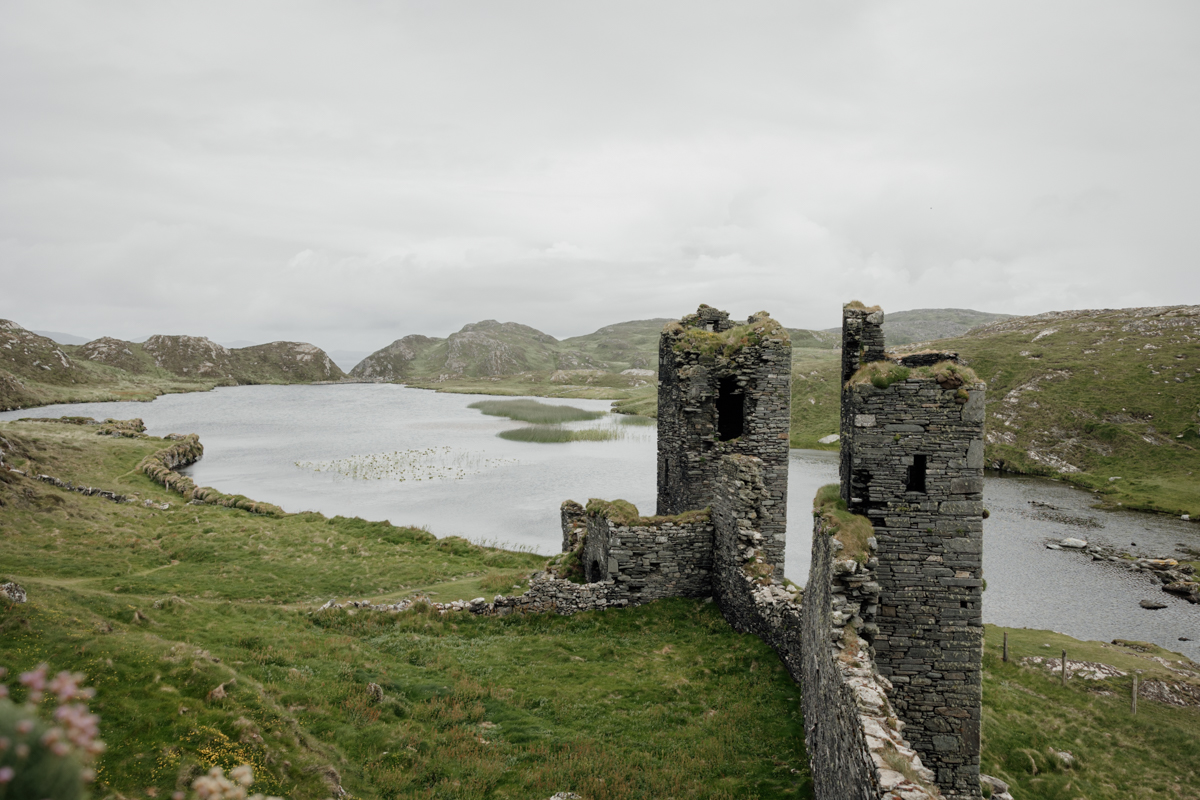 Ancient ruins of Three Castle Head overlooking Dunlough Lake, secret Ireland elopement spot in West Cork.
