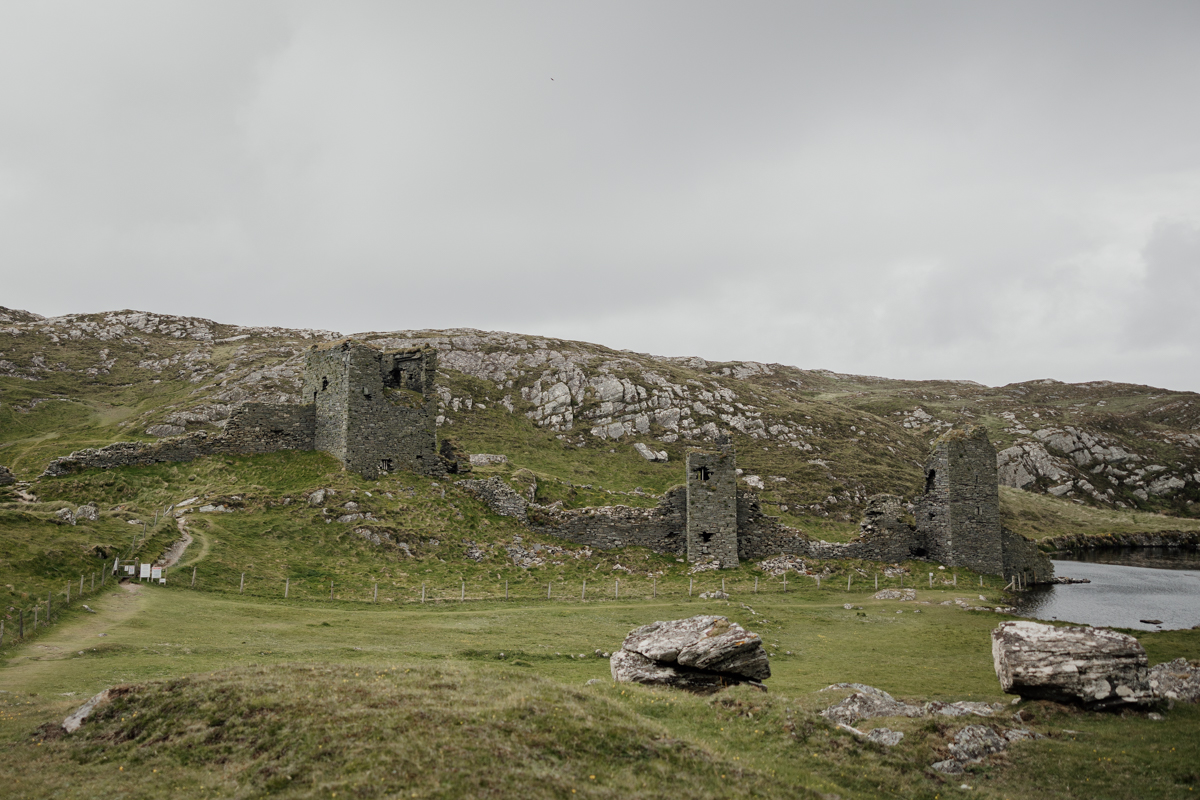 Wild Atlantic backdrop at Three Castle Head castle ruins, romantic elopement destination in Cork, Ireland.
