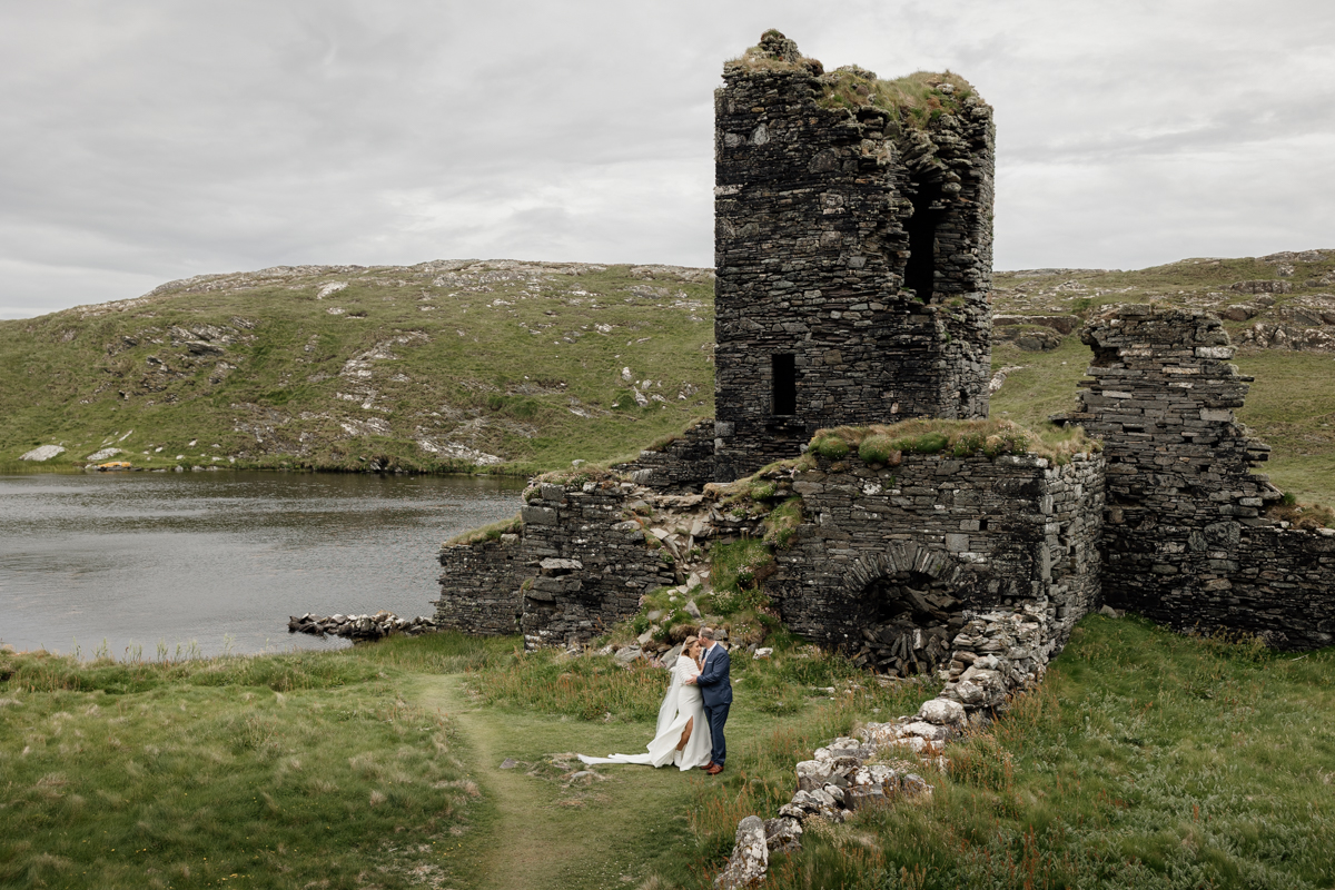Sunset elopement portraits at Three Castle Head cliffs, breathtaking Mizen Head views in West Cork, Ireland.