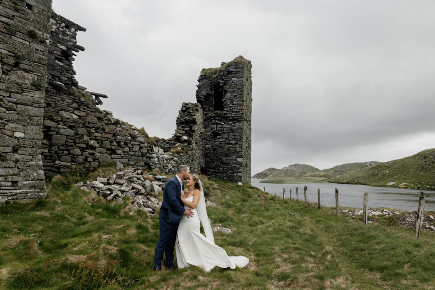 Intimate elopement portraits at Three Castle Head, one of the best places to elope in Ireland for U.S. couples.