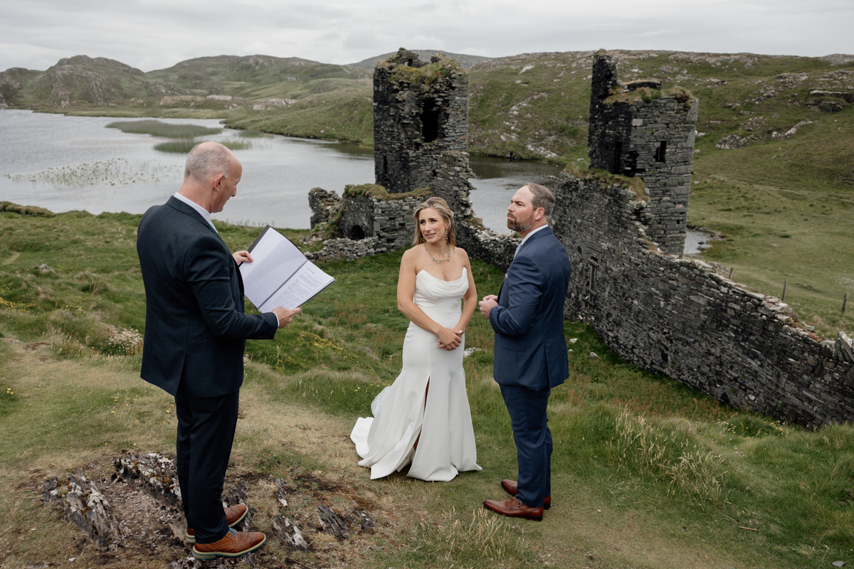 Wild and romantic elopement shoot at Mizen Head cliffs near Three Castle Head, Ireland.