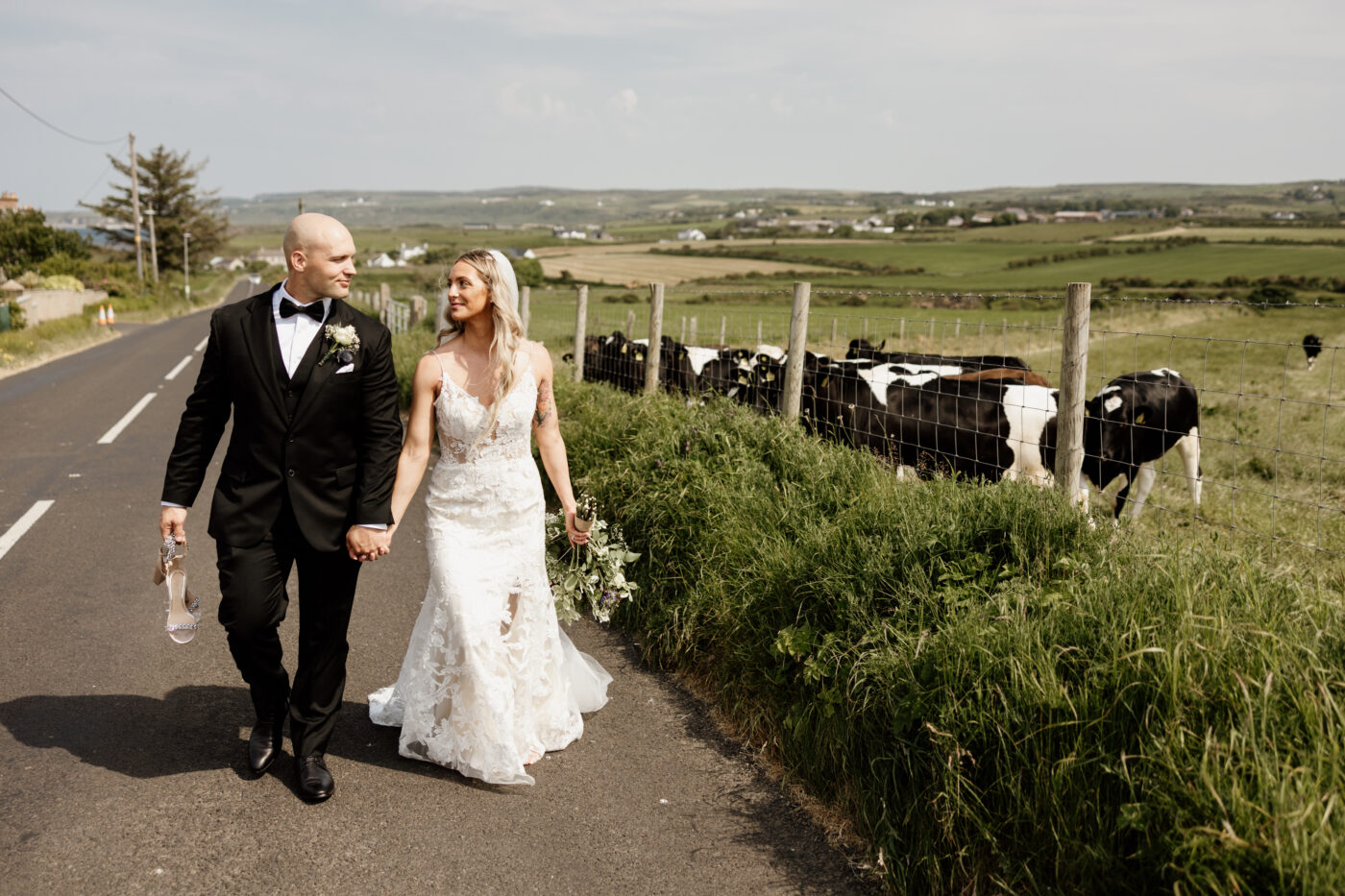 Dunluce Castle elopement ceremony with dramatic cliffs and ocean views